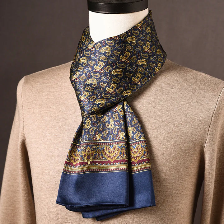 Men's navy silk scarf covered in gold paisley with an ornate burgundy and gold border band