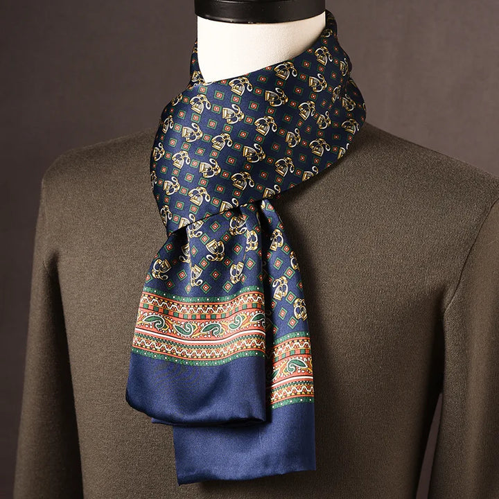 Men's navy silk scarf with small gold ornamental motifs and green diamonds and a colorful paisley border band