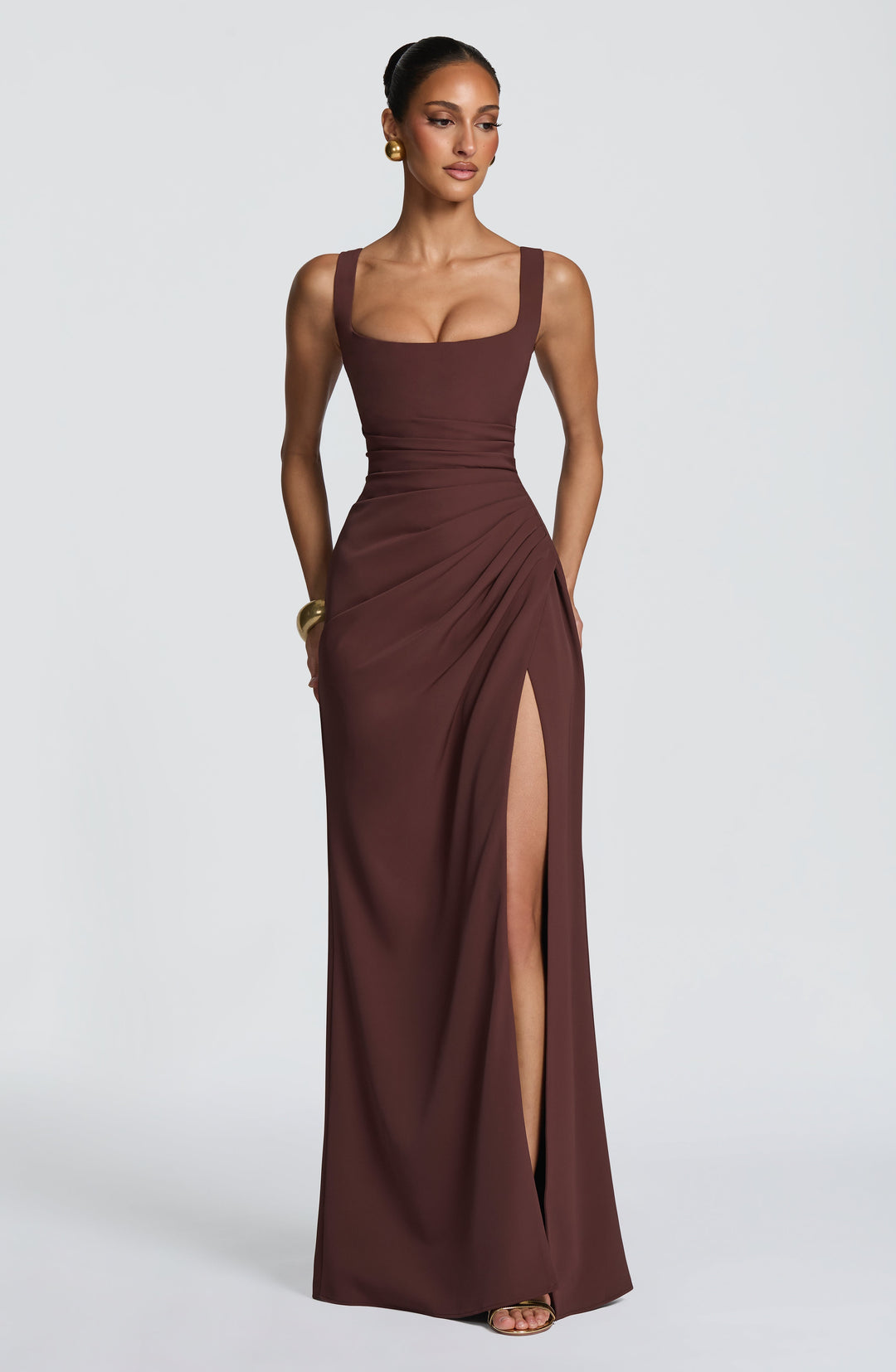 Brown Camille Maxi Dress with a square neckline, ruched waist and high side slit, front view.