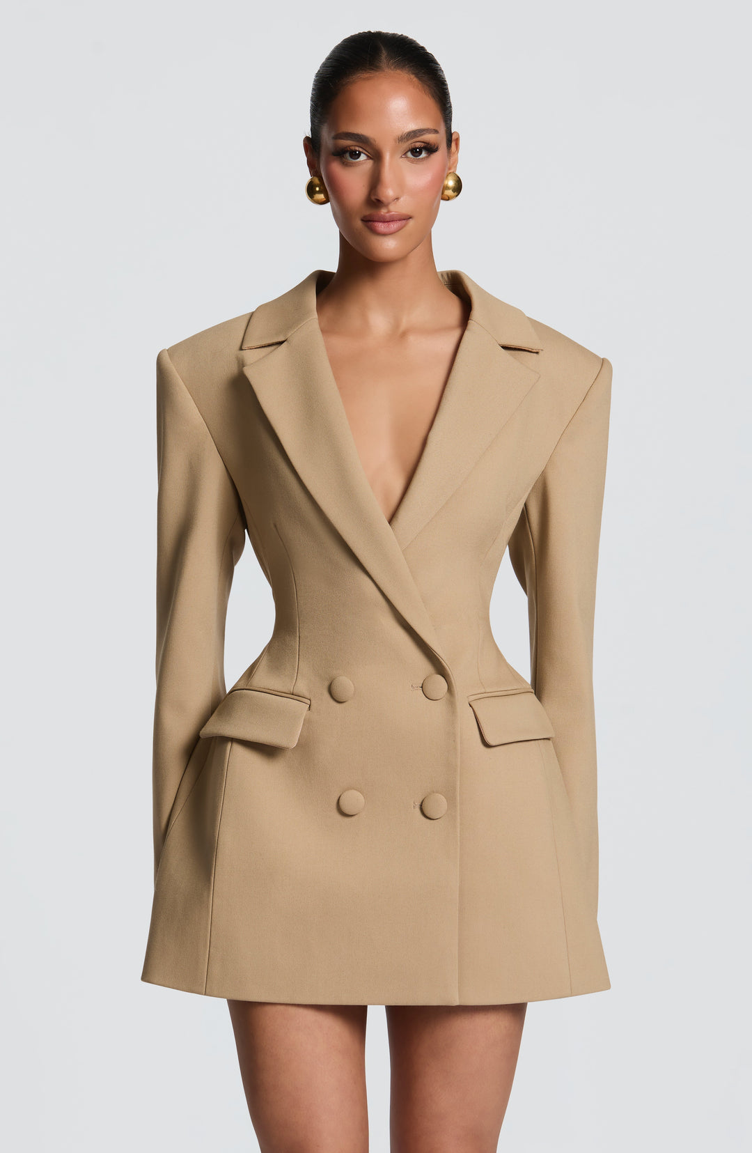 Camel blazer mini dress with a plunging neckline and flap pockets.