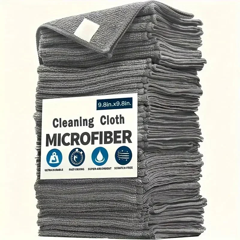 Grey microfiber cleaning cloths stack with a paper label, detail.