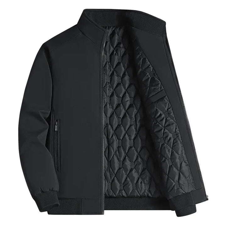 Black stand-collar zip jacket on a white background, unzipped to show the diamond-quilted lining, ribbed cuffs and hem, and a zippered side pocket. 1