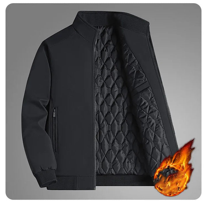 Black jacket unzipped at an angle on a gray background, showing the quilted lining, side zip pocket and ribbed cuffs, with a flame graphic. 10