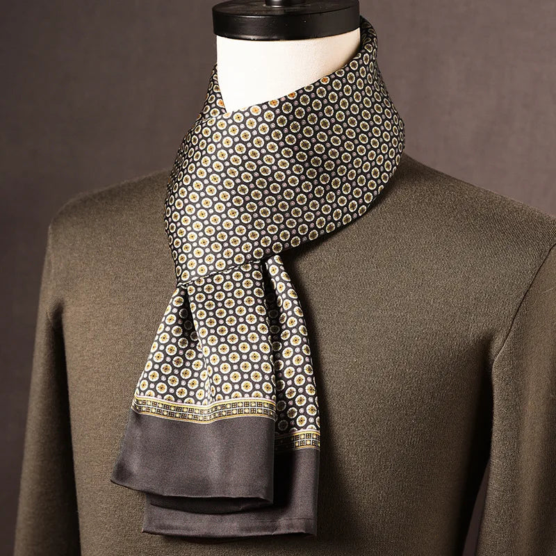 Men's dark gray silk scarf with small cream and gold medallion dots and a patterned border