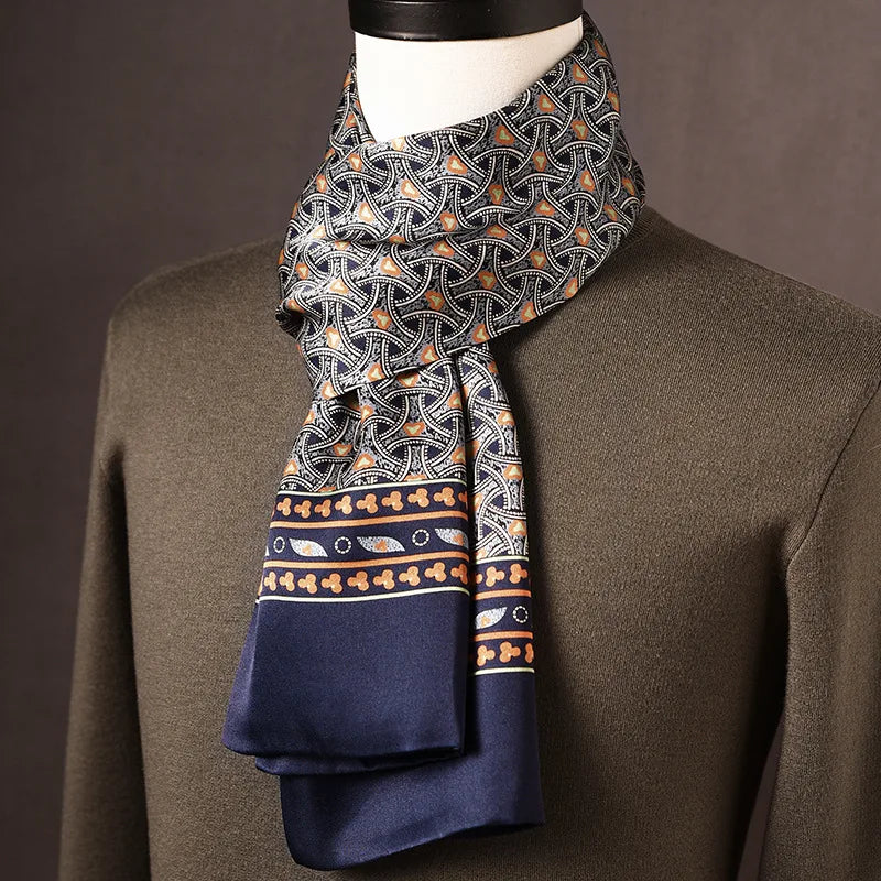 Men's navy silk scarf with an interlocking curved pattern in white and orange and a decorative border band