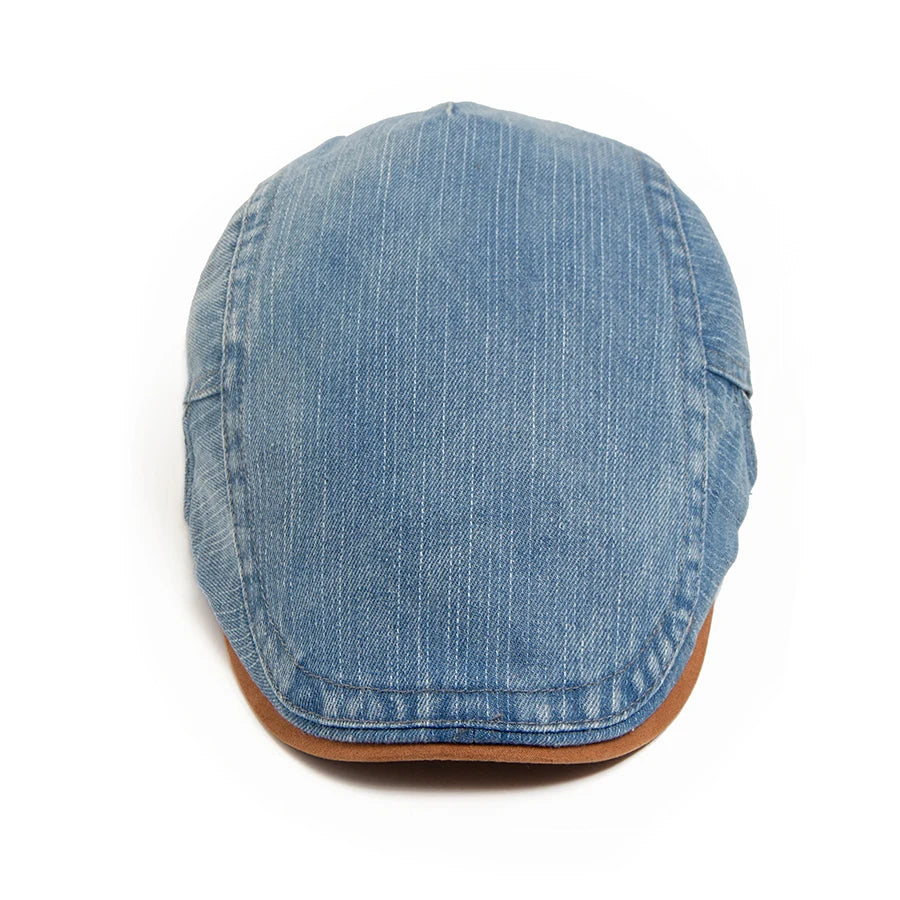 Men's blue pinstriped denim flat cap with a tan brim edge on a white background.