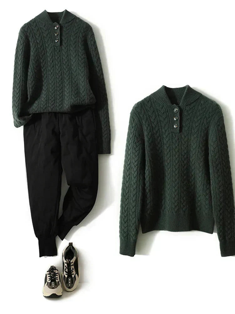 Flat lay of the dark green cable-knit sweater styled with black jogger pants and sneakers, beside a second sweater laid separately. 16