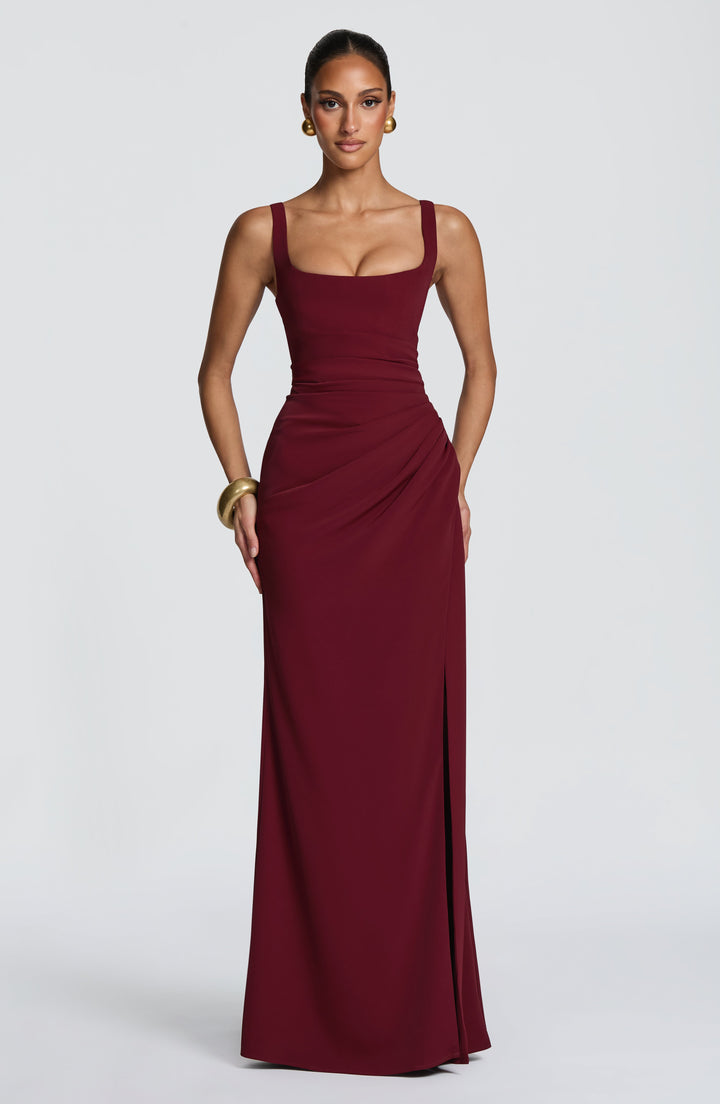 Burgundy Camille Maxi Dress front view with square neckline and ruched waist with the slit closed.
