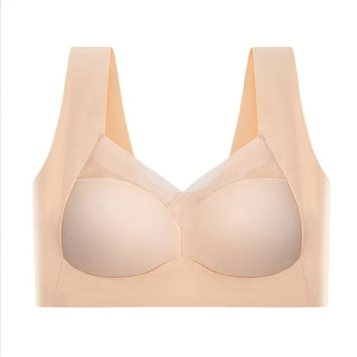 Beige bra laid flat, front view with molded cups, mesh-trimmed V-neckline, and wide shoulder straps.