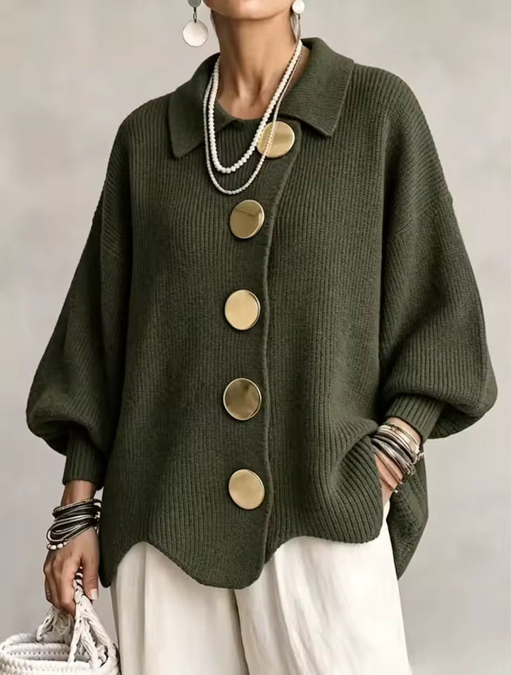 Olive green cardigan with gold buttons on a model.