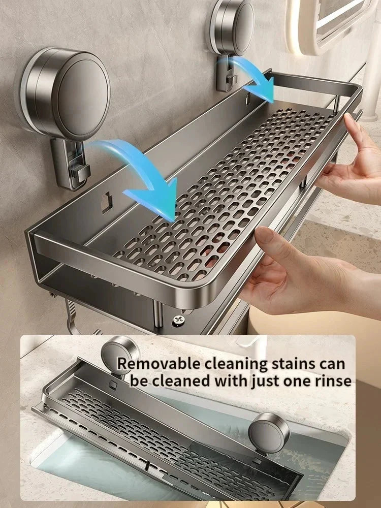 Gray metal suction cup bathroom shelf detail showing the removable design being rinsed