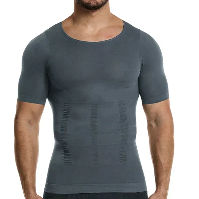 Front view of a man wearing the gray compression top, with vertical ruched shaping lines on the abdomen. 6