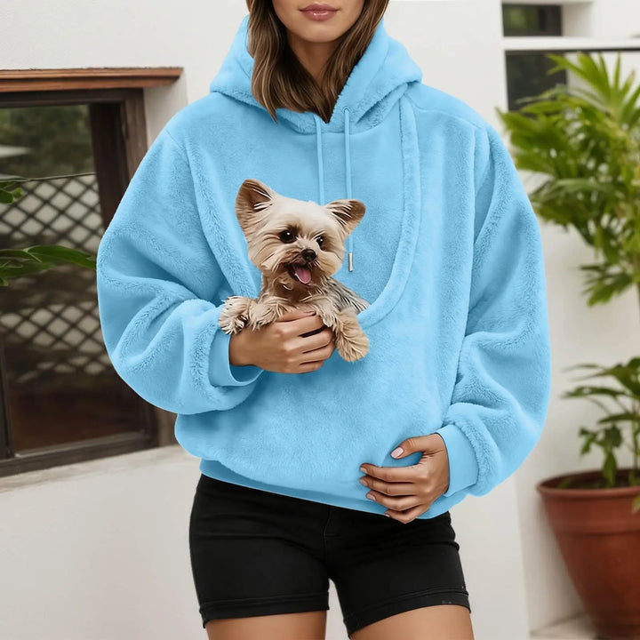 Light blue fluffy hoodie with a built-in front pouch holding a small terrier
