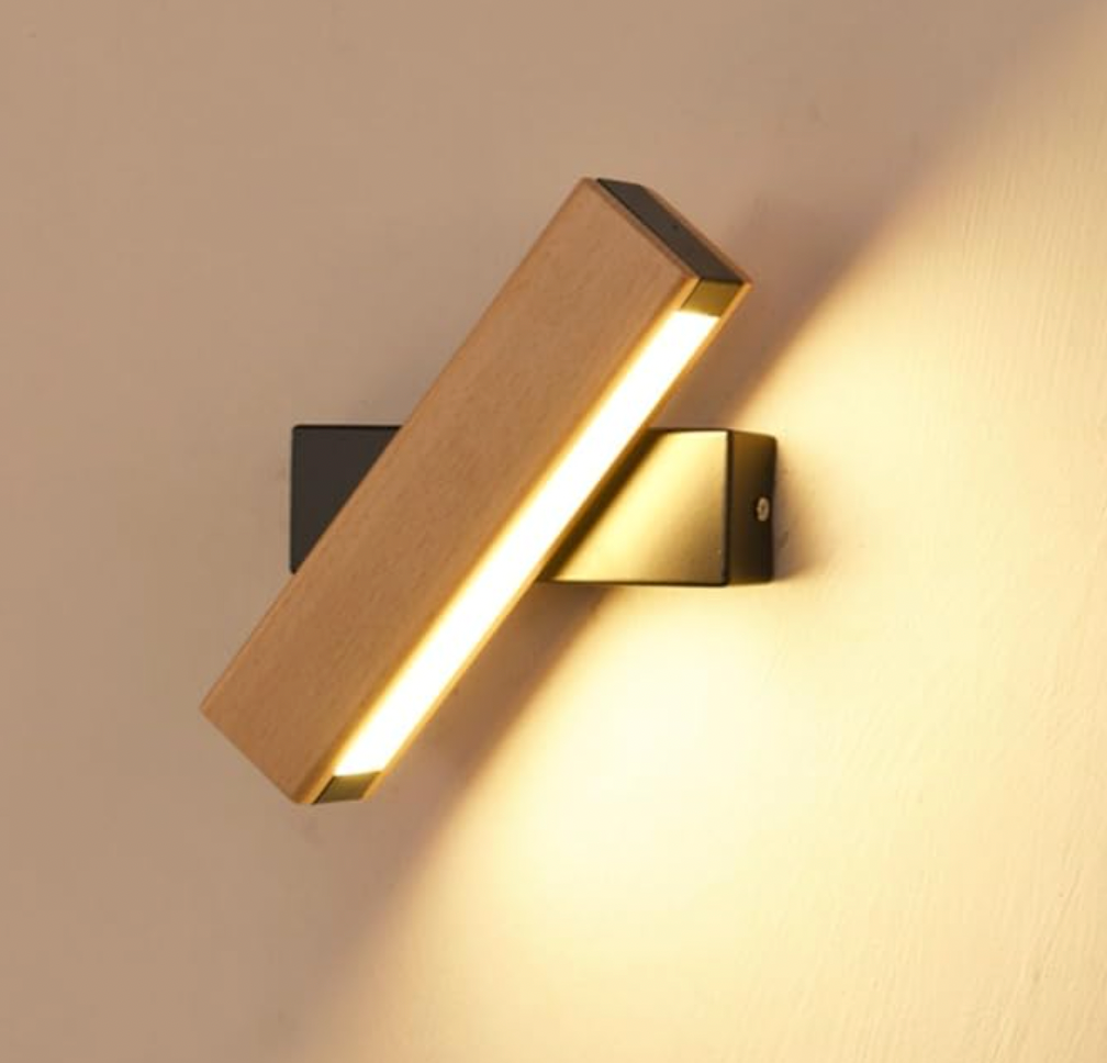 Beige and white Japanese-style LED wall light, close-up detail of the lit LED strip on a black mount.
