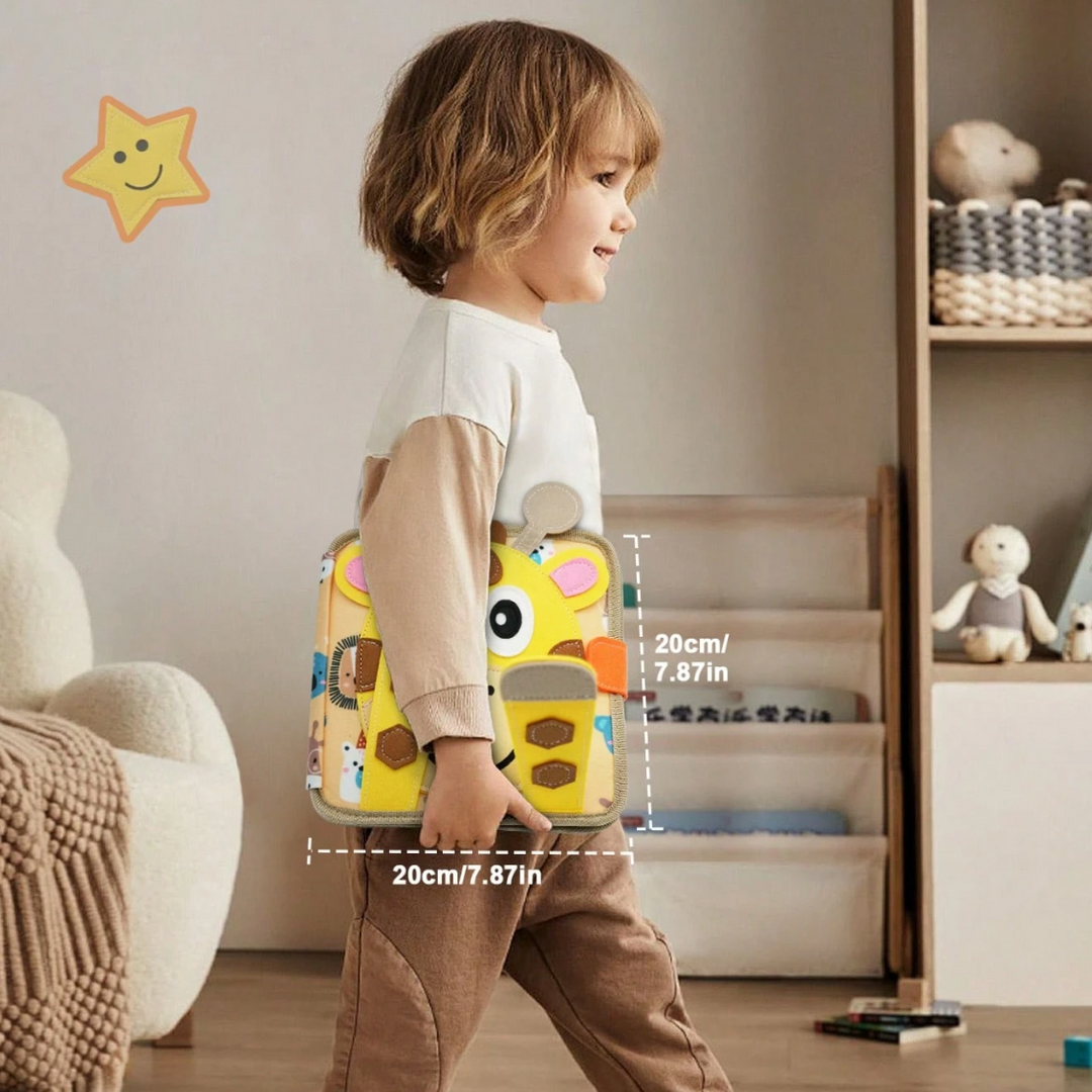 Toddler walking and carrying the giraffe-cover felt book under one arm to show its compact size, with dimension markings.