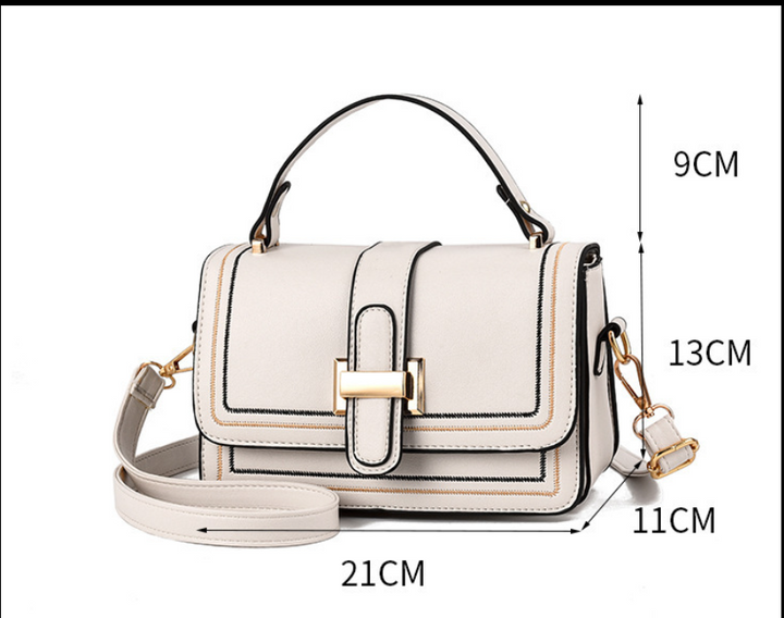 Cream bag front view with measurement lines marking height, handle drop, depth and width. 9