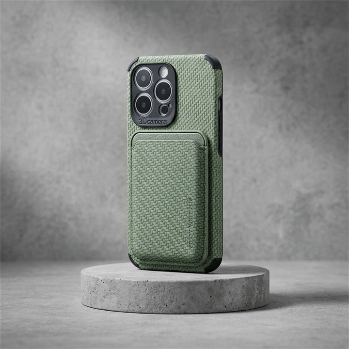 Green woven-texture case with card pocket and black bumpers, displayed on a round concrete pedestal 3