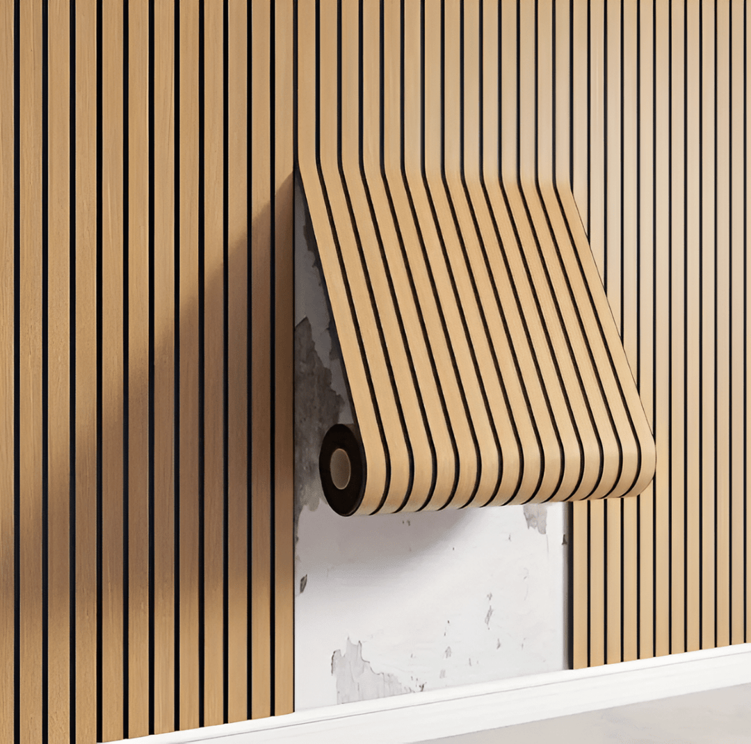 Self-adhesive wood panels in beige and brown unrolling onto a wall, showing the adhesive backing.