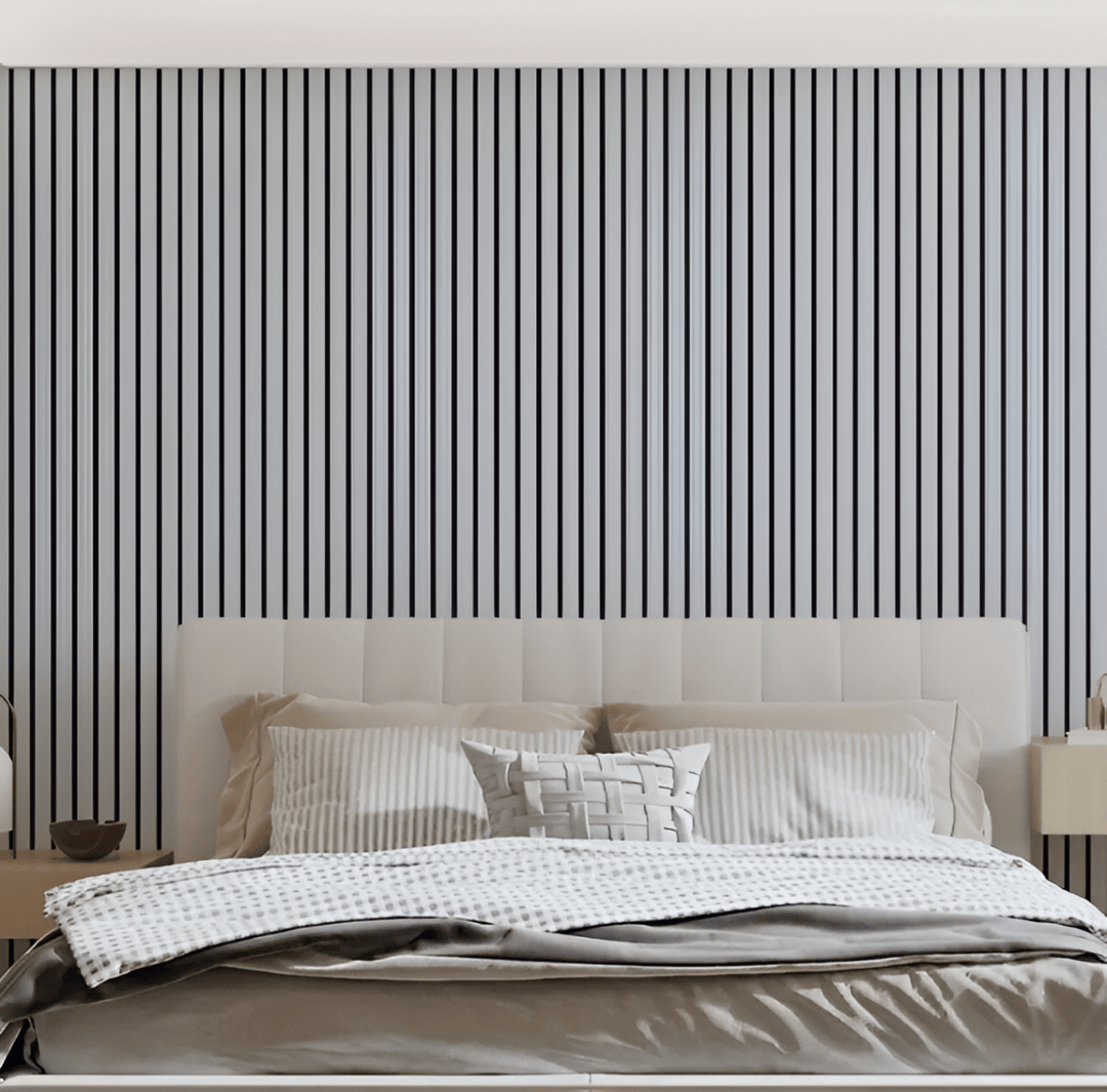 Self-adhesive wood panels in white and black behind a cream tufted bed.
