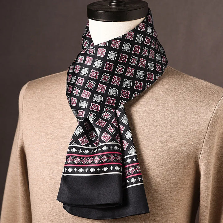 Men's black silk scarf with pink and white square medallion motifs and a diamond-patterned border stripe