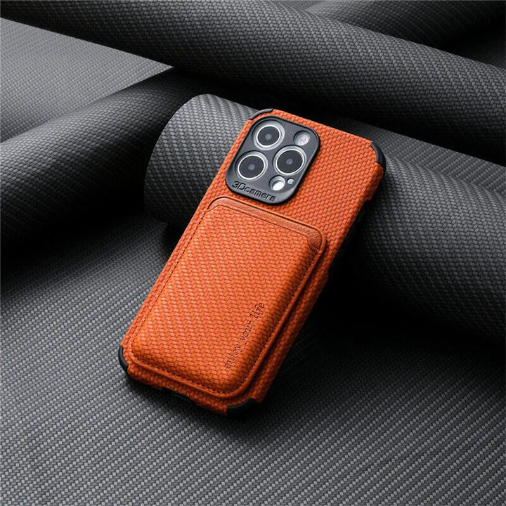 Orange textured case with the card wallet attached to the back, resting on rolled dark fabric 4