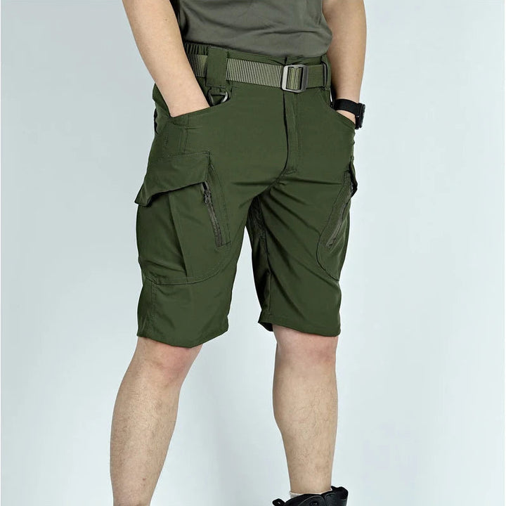 Another view of olive green cargo shorts with a belt, showing the zippered cargo pockets.