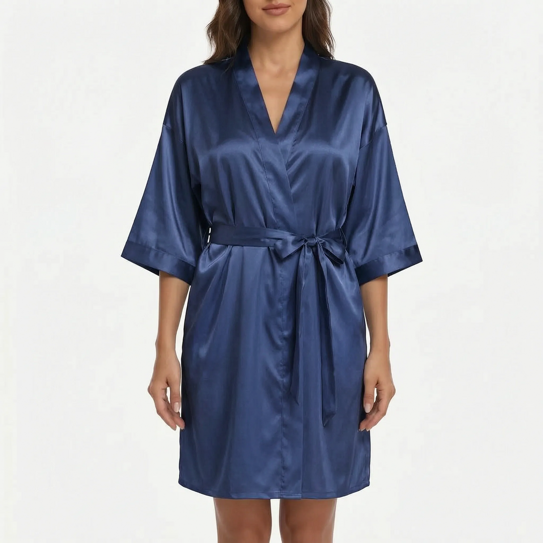 Model wearing the satin robe in navy blue, front view with a belt tied in a bow. 14
