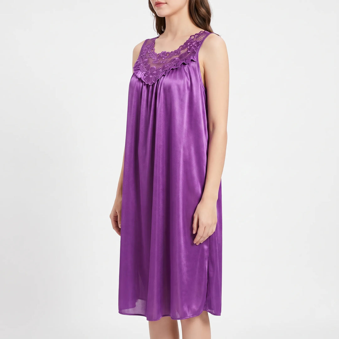 Three-quarter side view of the purple nightgown on a model, showing the lace neckline, ruffle trim and flowing satin skirt. 4