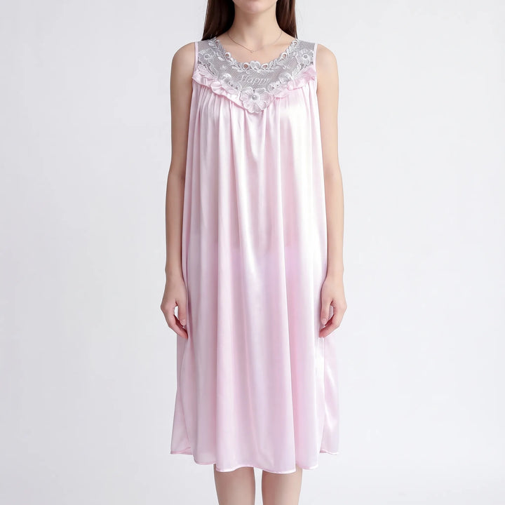 Pale pink version of the nightgown on a model, with silver-gray embroidered lace yoke and a ruffled V-shaped trim. 6