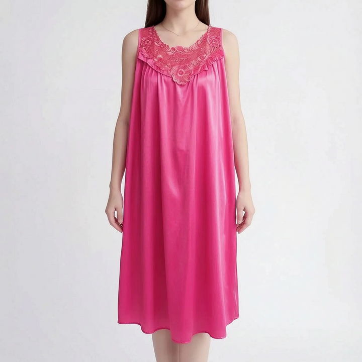 Bright hot pink version on a model, showing the floral lace yoke, ruffle trim and flowing satin skirt. 9