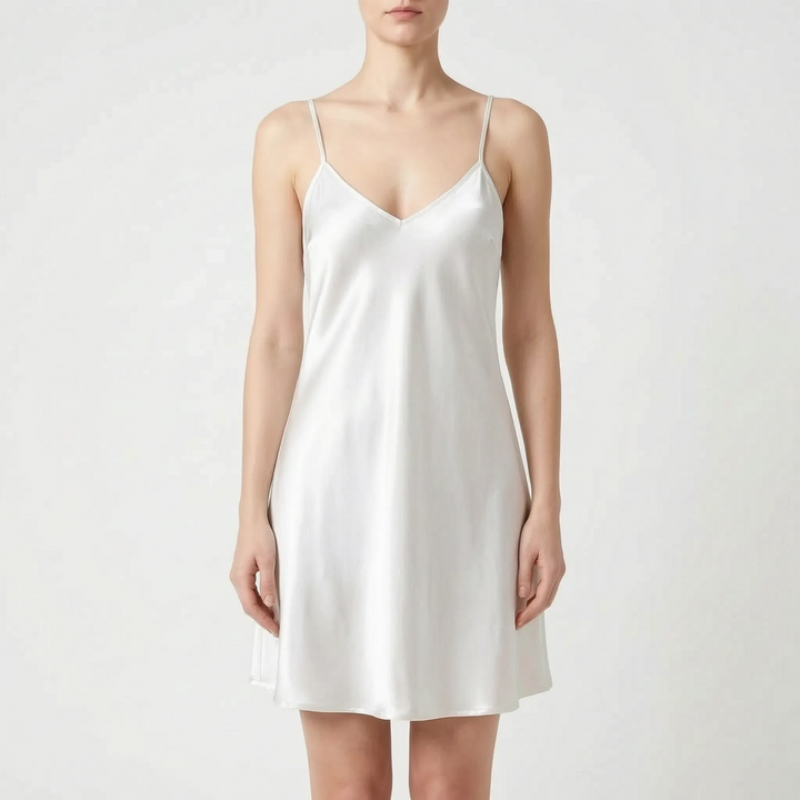 Model wearing the slip nightdress in an ivory-white shade, front view on a light gray background. 6