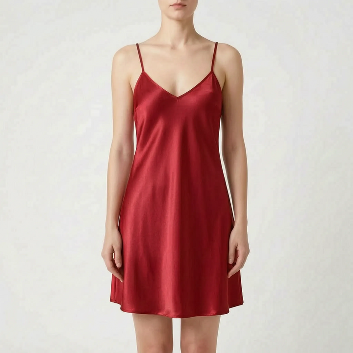 Model wearing the slip nightdress in deep red satin, front view on a light gray background. 8