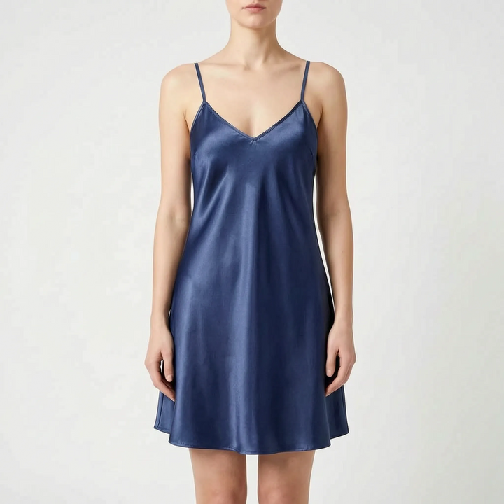 Model wearing the slip nightdress in navy blue satin, front view on a light gray background. 9