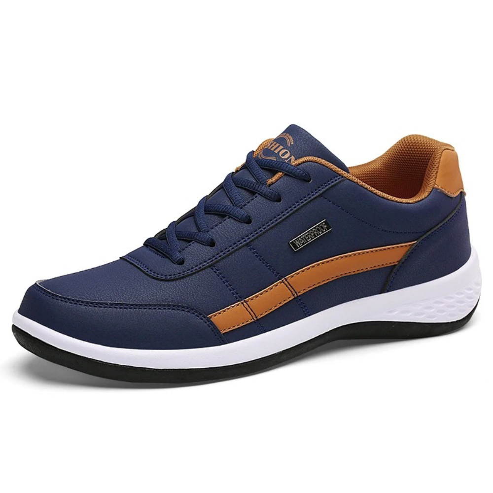 Single navy blue leather sneaker with a tan side stripe and white sole.