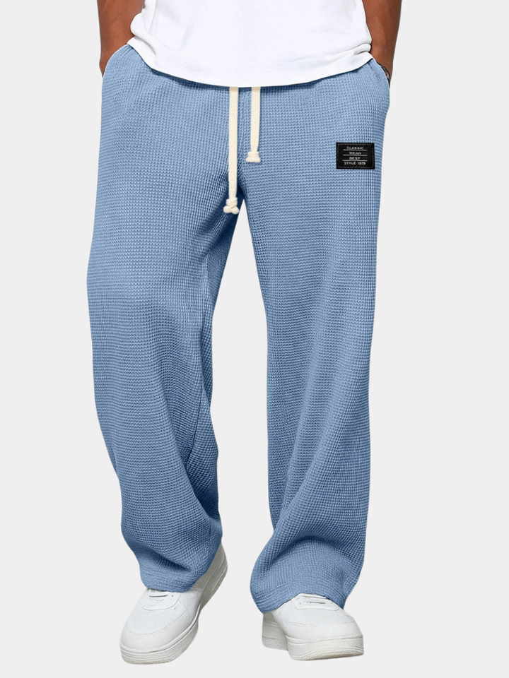 Front view of the wide leg waffle knit pants in light blue, worn with a white tee 4