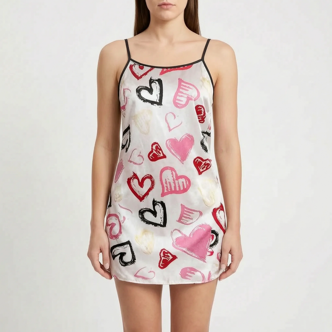 Front view on a model of the white satin nightgown covered in brushstroke hearts in pink, red, black and cream, with black trim. 12