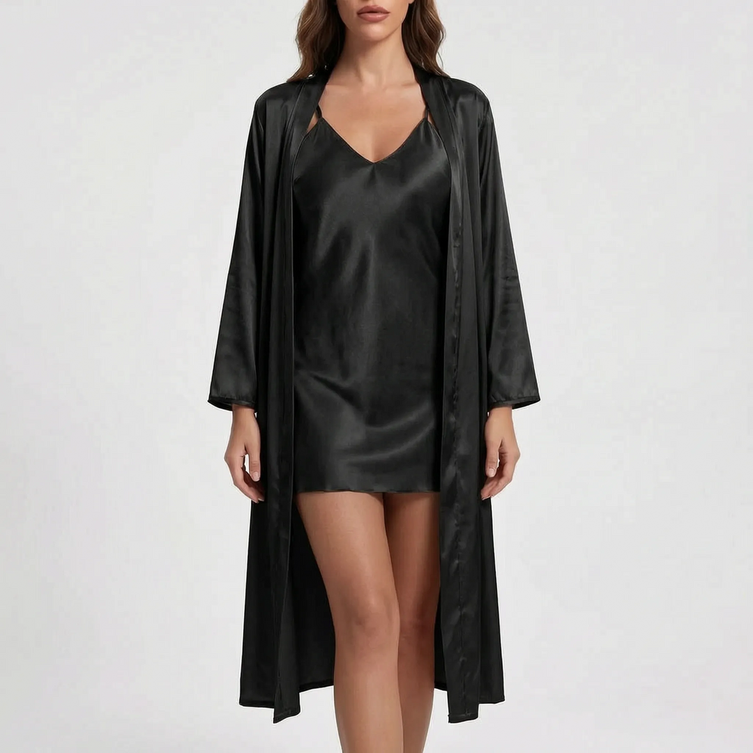 Front view of the set in black satin, with the open long-sleeved robe over a V-neck slip dress, on a light background. 8