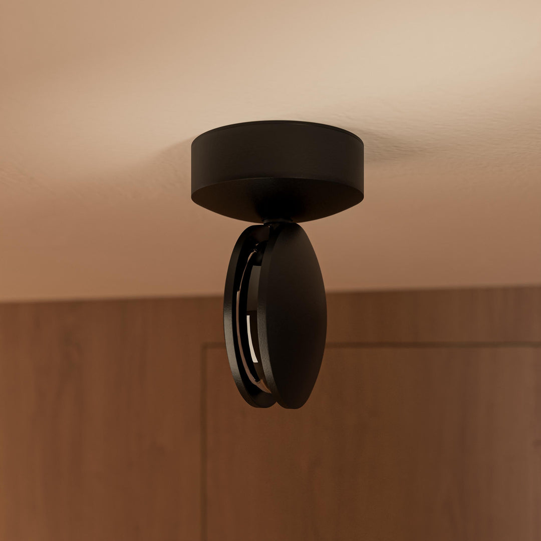 Black LED wall light detail, showing the slim profile and open slot.