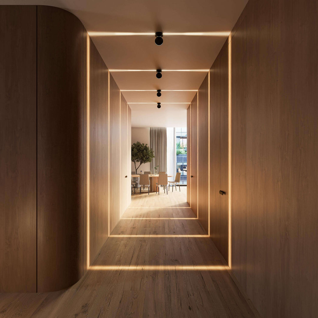 Black LED wall sconce another view showing square light frames on walls and floor in a hallway.