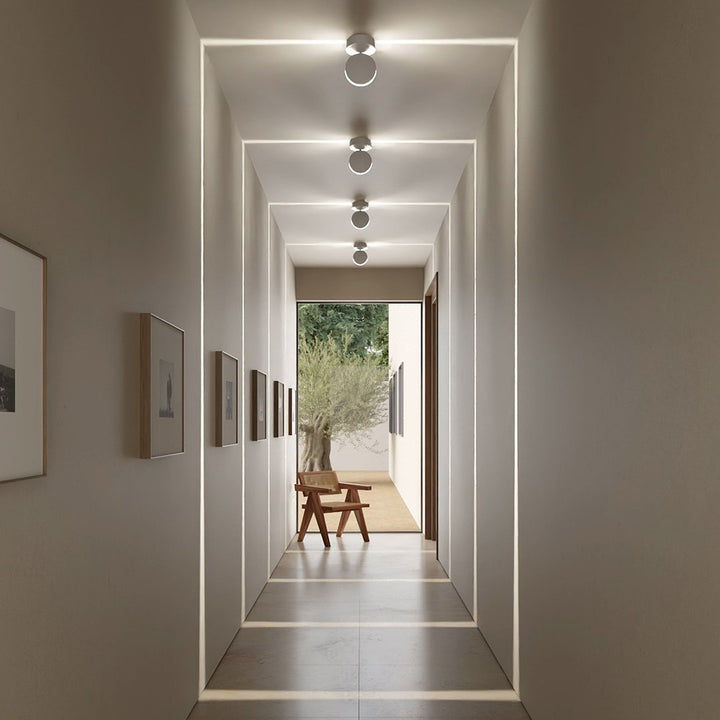 White LED wall sconce another view showing a row of fixtures projecting rectangular light frames.