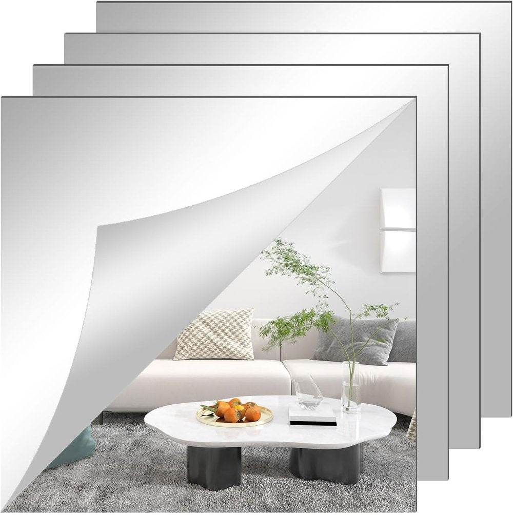 Stacked square mirror film sheets with one corner peeled back.