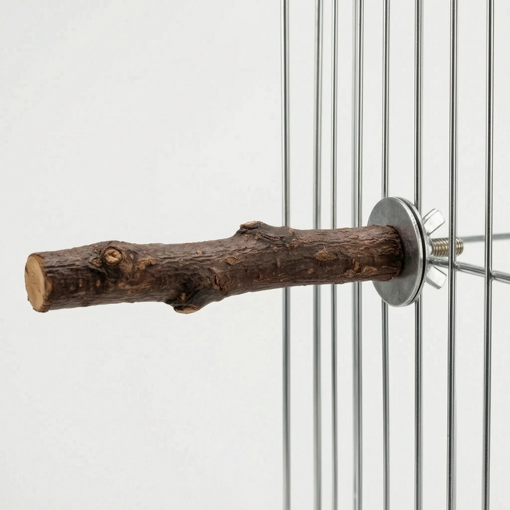 Side view of the bark-covered branch perch mounted on cage bars, with its fastening hardware visible and the cut end facing left. 5