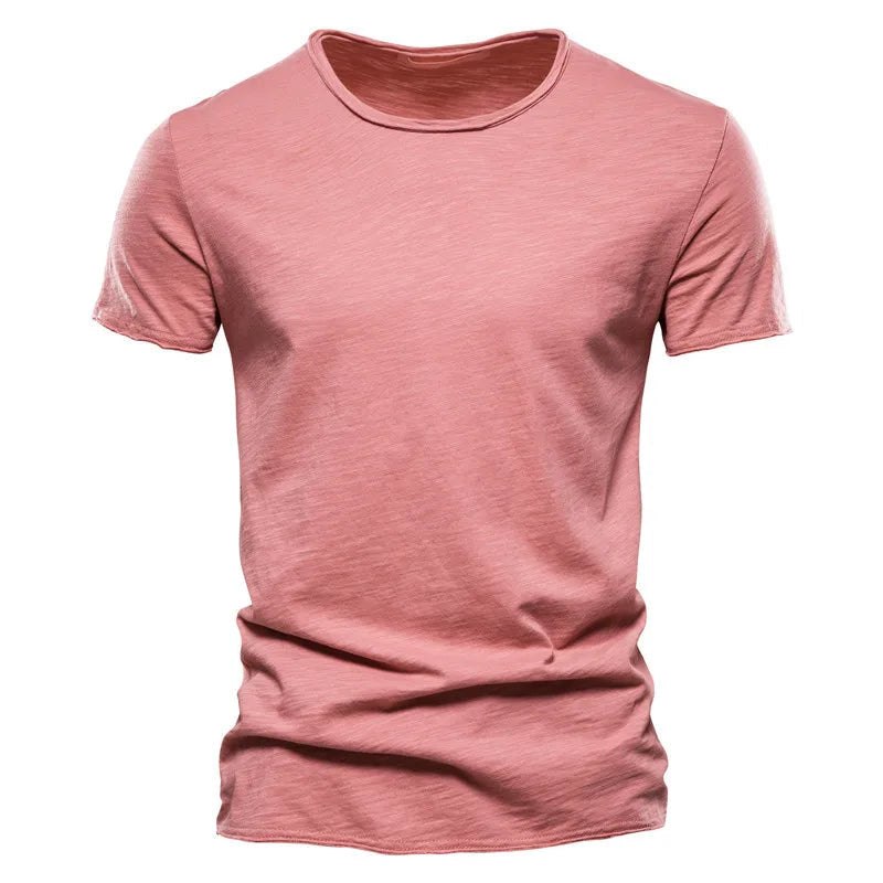 Coral pink Men's T-Shirt with a raw-edge collar and textured slub fabric, laid flat from the front.