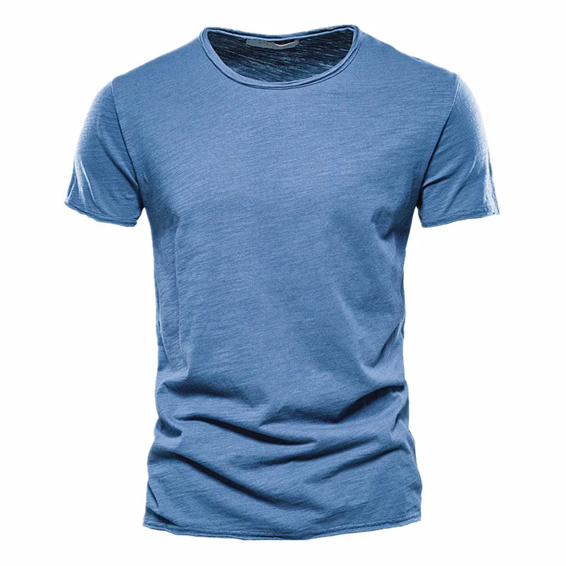 Medium blue Men's T-Shirt with a raw-edge collar and sleeve hems, laid flat from the front.