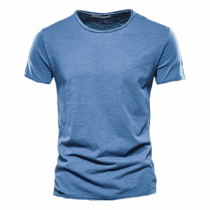 Medium blue Men's T-Shirt with a raw-edge collar and sleeve hems, laid flat from the front.