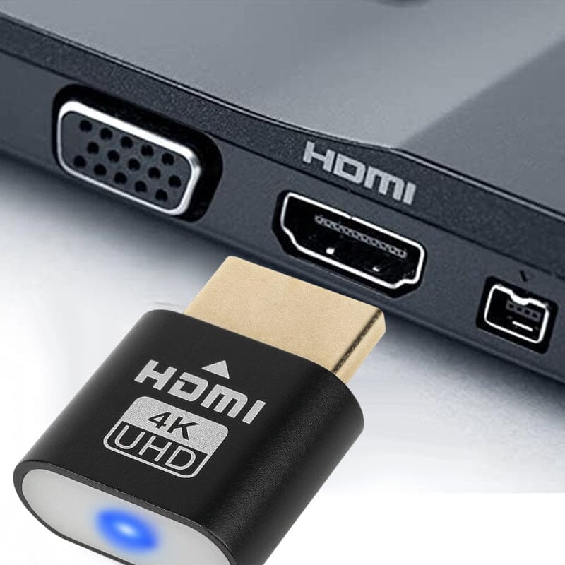 Black dongle detail in front of an HDMI port on a laptop's side, next to a VGA port