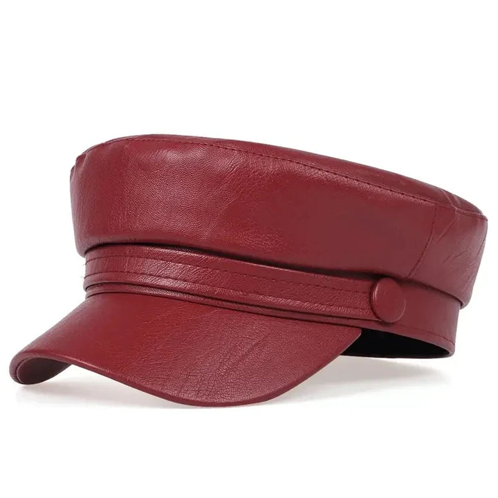 Burgundy red leather-look flat cap with a button strap, three-quarter view 13