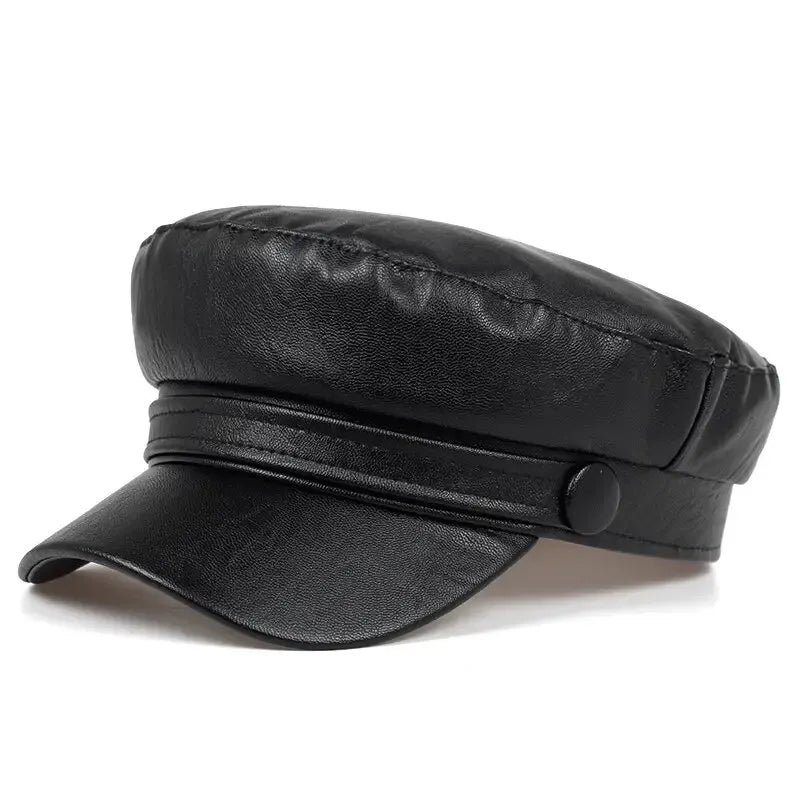 Black leather-look flat cap with short visor and button strap, shown at a three-quarter angle 2