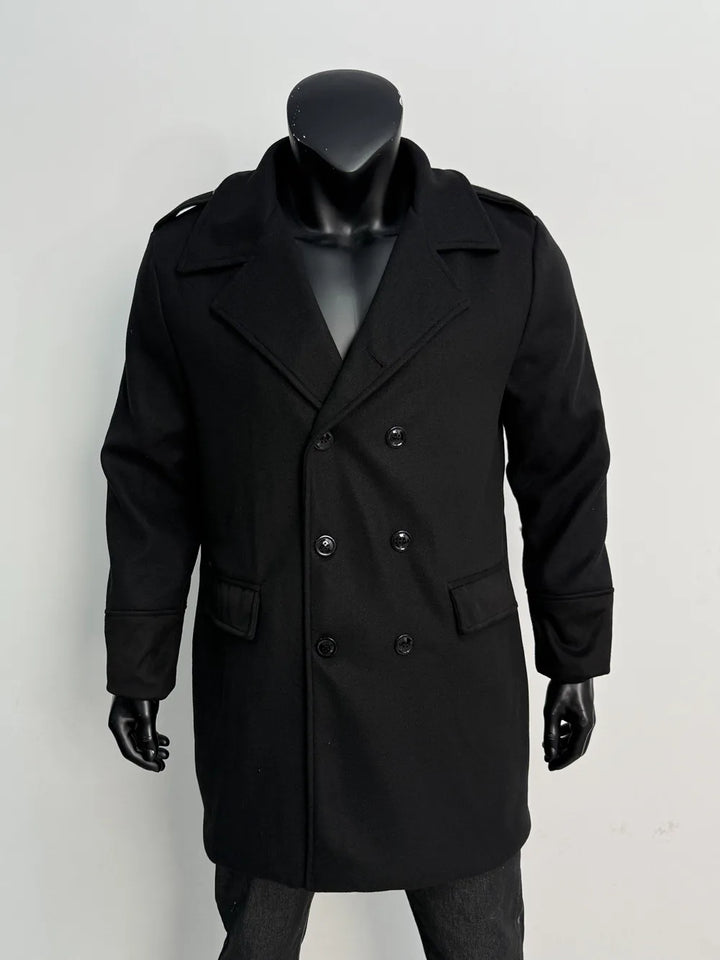Black double-breasted coat on a black mannequin, front view with black buttons, notched lapels, flap pockets and epaulettes 15