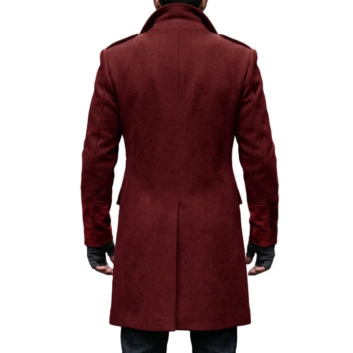 Back view of the burgundy overcoat on a model, showing the center seam, epaulettes and suede-look cuffs 17
